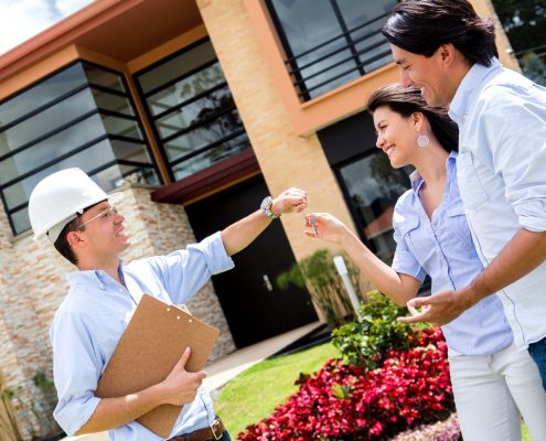 Architect Handling Keys To A Couple | Recycling Services | Storage Container Rentals | Parberry Environmental Solutions